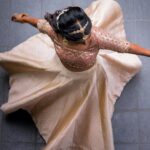 Deepika Venkatachalam Instagram - #WeddingLookBook ( Engagement : 1/4 ) Your D is back with a styling series again, and this time, it's for our #RnDwedding. Ah Still feels surreal :")🧿 The first outfit I wore for this special occasion was nothing short of magical. It was a breathtaking lehenga with a panelled skirt and a stunning hand-embroidered crop top. My stylist @artra1210 wanted it to be both traditional and modern, so I can reuse it forever 😅 . @fiorebymalar_ Akka spent days working on the crop top and made sure it looked royal as well. 🥹 Everyone loved how the top and skirt complemented each other and blended with the Kerala theme. But ena dhan plan panaaalum., konjam sodhapum la .. 😅 Long story short- I missed my dupatta. (Watch our engagement film on YouTube to know what happened later then. Dupatta vechi Oru kutty promotion.hehe) As it was getting late for the ceremony, @artra1210 instantly got an idea to snatch a dupatta from one of my bridesmaids. 😂 And she legit styled it in a way it matched my whole outfit! -(This is why you need a wedding stylist brooo ❤️) “Ponnu naa dhan but naa potruka dupatta endhu ila“ 😂 We wanted both pieces of the outfit to be staple pieces so that they could be styled in different ways in the future and still look like a complete outfit even without the dupatta & I think we achieved the goal. For the jewellery styling, we were initially confused. But, the pro @artra1210 was so confident and decided to go for jewels that matched the crop top's colour. The beautiful outfit became even more stunning with the matching choker, head Tikka, and bangles from @rimliboutique ❤️ The outfit, makeup by @kabooki_mua , jewellery by @rimliboutique and decor by @tharunam.in came together beautifully, and with the vibrant smiles of our friends and family, it felt like a royal engagement. My then-fiancé and now-husband approved of my look at first glance and made me feel like a royal princess on our engagement day. So, does my #instafam approve of it? Let us know in the comments! 🌝 . 📸 @photonimage_by_daran . #RnDwedding #Engagement