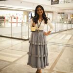 Deepika Venkatachalam Instagram - Your D is back again with a styling dress up game. OG's remember our #littlegame we used to do a few years back ?🥹 For our 4th award event, I wanted to try something new and ordered an outfit online, but unfortunately, I didn't receive it until 2 hours before the event. So I decided to go for styling an outfit myself with the basic knowledge and with the help of pinterest. I wanted to go for a saree or maxi dress. But pinterest had other ideas. Hehe. Right when I opened the app, it popped up a ruffle skirt outfit on the feed. That's when I remembered having a ruffle skirt myself, ( from @kanthadesignstdo ) that I sourced for Abi for season 1, but couldn't use it. So I decided to go for it with a fitted white crisp shirt, that I used a couple of times for brand shoots. ( White shirts are an absolute staple piece in our wardrobe, because it can be styled in 'n' number of ways- take notes ) Over the years you've seen me style a white shirt in many ways paired with maxi skirts, cargo pants, different types of jeans, palazzo and formal pants. I loved how this particular skirt and the shirt went well together, but with the 3 layered chain it seemed complete!❤️ ( and ofc with the medal and the award, it looked beyond perfect 🧿 ) I was nervous about the look since I styled it for an event. But right from the moment I stepped out of my room, everyone right from mom, dad, and people at the event complimented and approved the look. ( light ah proud feels 🌝 because it’s been ages since I styled myself ) What do my #instafam think of this look? Do you guys approve it?🥺 . Details : Shirt @hm Skirt @kanthadesignstdo Layered chain @westsidestores Shoes @metroshoesindia . 📸 @keshu_hariharan . #deepika #styling