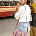 Deepika Venkatachalam Instagram - POV: A day in my life...(1/4) One morning I had to decide to just take a stroll and travel through the city and look where I landed..! “A bus stand” 📍🚎 A place where mass floating population walks in and out through any day. A whole surrounding where emotions run high for each one boarding a bus. I saw college goers with bags and dreams, office goers wearing ID cards and wondering about their day and many more people who had so much work to do in the day trying to board their bus. It took me a minute to realise I was definitely privileged where I could afford a cab if I really wish while there are a lot outside who wait for a bus even upon an emergency. I just took a minute to send some prayers, luck and love to all those eyes I met that day at the bus stand to reach their dreams, wishes and desires and smile throughout their lives. 🤍 Littlest of what we could do, right? 😍 Also, with summer 🌞 scorching the city I wanted to stay simple and wore a chic white shirt and a pair of well fitted jeans! Carried a pretty printed bag ( @zoukonline ) with me to put in everything from a phone to keys to wallet to literally every damn thing. These printed bags are something very Indian and carry an aesthetic with any kinda outfit! 💟 . . Yeah, I had another planned to visit elsewhere and stay tuned to know more! ➡️ . 📸 @keshu_hariharan @thatmadraskaran . #deepika #chennaiblogger #chennaiinfluencer