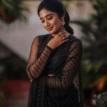 Deepika Venkatachalam Instagram - Black Saree - A Timeless Classic🖤 ft @bespoke.dhishya ✨ The moment I came to know that we were nominated for the She Awards, I knew I should look great on the day, no matter if we won the black lady or not. The first person I called was Pavi @artra_styling , (she was the one who did our engagement styling) and when I told her about the award nominations she was more excited than us and was in full swing to make me look my best on our big day. Pavi suggested a black saree look to keep the simple and ethnic girl-next-door vibe ON and to match the aesthetic of the award- the black lady. We were searching for a lot of options and the one look that grabbed our attention in an instant and made us head over heels in love was this black sequin saree from @bespoke.dhishya 🖤 It looked perfect for an award show and I’m sure I’d restyle it for my cousin’s or friend’s reception too. ( Receptions and Black! Hehe. 🙈 iykyk) For the blouse we decided to go classic with full sleeves and a boat neck and team @d.sign.d were sweet enough to do it in the last minute for us with full embroidery and perfectly delivered it in no time. 101 reasons why I go back to them, again and again ✅ To keep the attention on the saree, Pavi suggested only a white stoned flower motif designed ring and earring from @aaranyarentaljewellery and it was just perfect! 💎 We wanted to keep the makeup & hairdo minimum and @athmika_makeupstories gave a subtle look just like how I wanted and @priyaprabu_artistry did a super cute ponytail that elevated the whole look beautifully. When I stepped out of my room all dolled up, Amma was so stunned looking at me and loved the whole look. Enna thaan veliya 1000 peru sonnalum, Amma solra "Azhagaa irukaa dii" is always special laa?🥹 We quickaahh went to the terrace and clicked some beautiful pictures before we went to the event. And that night we were back home with the Black Lady on our hands. Always grateful for that night and the love I received 🖤 But now looking at the pictures makes me think this would be a classy look for a Diwali evening party. 🔥 #DiwaliwithD (8/10) What say guys?🌝 . 📸 @mukesh__dm . #deepika #diwaliwithD #chennaiinfluencer