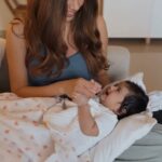 Malvika Sitlani Instagram - My Abby is 3 months old today 🥹 She is growing up to be SO cute. She is sassy 👠 She is dramatic 💅 She loves to fake cry and then laugh 😅 She looks at herself in the mirror and smiles wide 😍 She is such a happy baby 🩷 No matter how tired I am these days, she looks at me like I’m her entire world… & that makes me want to push myself just one more time 🫶🏻 Can’t wait to cuddle with her in bed and eat cake some day 🫶🏻🎂🧁