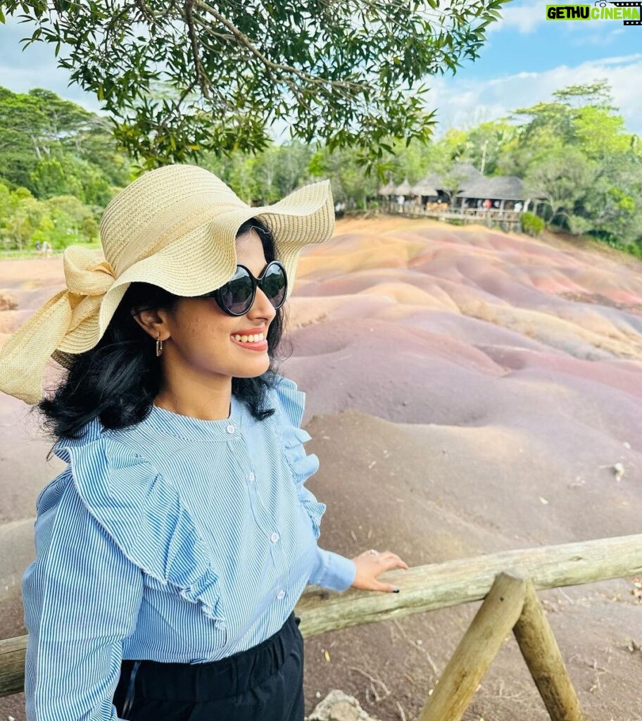 Niharika Dash Instagram - The Seven Coloured Earths refer to a natural phenomenon in Chamarel, Mauritius, where the sand dunes display seven distinct colors, ranging from red, brown, violet, blue, green, to yellow. This unique geological feature is a popular tourist attraction due to the striking and vibrant hues created by the mineral content of the sand. ❤️ Chamarel 7 Coloured Earth Geopark, Mauritius