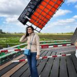 Niyati Joshi Instagram – Cold and crazy wind makes you forget FASHION 😂
It’s all about SURVIVING the blustery wind.
That’s a windmill fan blade in the background  in a Dutch country side village called ZAANSE SCHANS ,famous for its wooden windmills . 

#zaanseschans #amsterdam #europe #countryside #actor #niyatijoshi Zaanse Schans- A Windmill Village