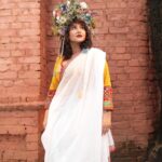 Swastika Mukherjee Instagram – Recreating one of Mashi’s saree borders on a dhuti – simple white as the Sarat Ritu clouds and a thin paar with Aam Kolka and Flowers. Dhuti in the length of a saree so that it can be worn as both.
@swastikamukherjee13 looks straight out of a Greek fantasy world in our blouse and her mother’s saree recreated in Tant.
Styled by @rishabhad 
Managed by @lipstickler 
Photographer: @upaharbiswas 
Make up: @prosenjit4867 
Hair : @mallicknita.bigbi 
Location : Courtesy @ranit.maiti Kolkata