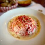 Adam Liaw Instagram - Lunch of fuffy things in sauce. Quenelle de brochet with sauce Nantua and Île flottante with Lyonnaise praline from Daniel et Denise. This was the best quenelle I had in Lyon.
