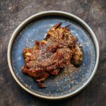 Adam Liaw Instagram - Tonight’s dinner. Sichuan lamb shoulder. Lamb shoulder cooked for 5 hours, then stripped off the bone and tossed in a sweet doubanjiang glaze then covered with a mixture of roasted fennel seed, cumin, Sichuan peppercorn, chilli and nori. This was soooo good.