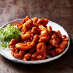 Adam Liaw Instagram - Tomato sauce chicken for Wok Wednesday. Every single time I have made this dish for people who haven’t tried it before there has ALWAYS been someone who says, “I’m going to make that!” However, my biggest win was probably when one of my son’s friends came over for dinner and we had this and he asked me to send his mum the recipe 😊 The sauce is a mixture of tomato sauce (ketchup), white vinegar, soy sauce, sugar and sesame oil. The full recipe is on p74 of 7 Days of Dinner.