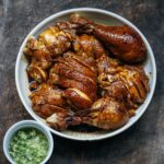 Adam Liaw Instagram - Tonight’s dinner. Soy sauce chicken with ginger and spring onion oil. I haven’t made lo sui (sometimes called “master stock” in English but the literal translation is “old water” 😂) in a while but I’ll boil and freeze this stock now for a few repeat performances. The stock is water, homemade wine, onion, garlic, ginger, sugar, anise, black cardamom, chuan xiong, cinnamon, etc.) and the chicken marylands simmer at very, very low heat for 45 minutes.