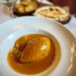 Adam Liaw Instagram - Lunch of fuffy things in sauce. Quenelle de brochet with sauce Nantua and Île flottante with Lyonnaise praline from Daniel et Denise. This was the best quenelle I had in Lyon.