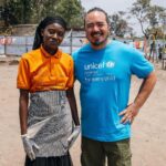 Adam Liaw Instagram – This is the UNICEF-supported #GreenGirls initiative where young women from #Sobel produce ecological charcoal from collected waste. 

We often think of the effects of climate change first impacting low-lying island nations, but #Sobel is a camp for more than 6000 Burundians who have been displaced because of extreme flooding caused by climate change.

Climate change is already having a big impact on Burundi, from increasing frequency of extreme weather events like flooding, to decreased agricultural yields caused by prolonged rainy seasons.

The Green Girls program an ingenious multi-dimensional solution to may of the problems facing these climate refugees. 

Firewood collection is a task usually performed by young women, who may have to walk for hours to find appropriate firewood. This exposes them to a high risk of sexual assault, and firewood collection contributes to deforestation. 

By producing ecological charcoal the girls don’t have to search for firewood, protecting them from potential assaults, and it also reduces deforestation and provides them with an additional source of income from the sale of surplus charcoal. An ingenious solution to a multi-dimensional problem.

It was fabulous to see this initiative first-hand, chat with the girls and play with many of the kids from Sobel.