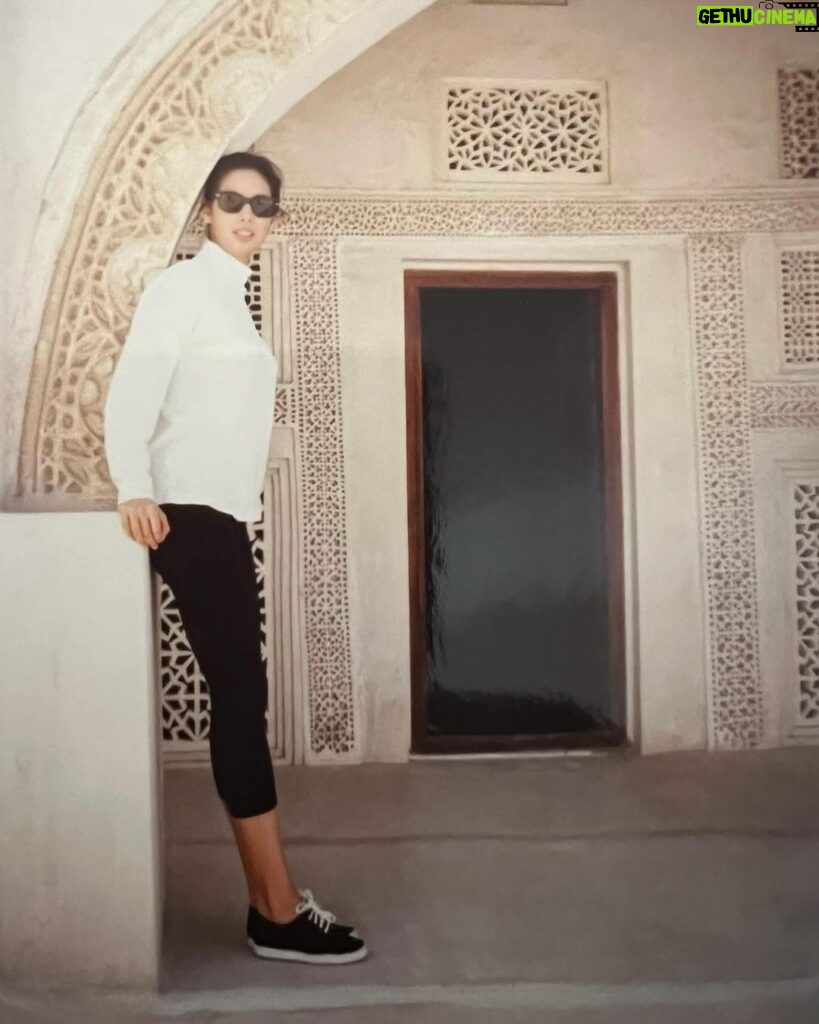 Alex Meneses Instagram - #tbt This photo was taken in Bahrain, The Kingdom of Bahrain. It’s a very beautiful place. I’m standing in front of a Mosque that was built more than 2,000 years ago. I was not allowed to go into the Mosque or to go across the bridge to Saudi Arabia. I was there for a modeling job. They needed someone to represent Kotex sanitary pads. Seriously. They needed someone who could look Arabic, but not too Arabic. I never understood what that meant, but it felt insulting. There were alot of girls who were afraid to go. I wasn’t. Travel was the thing I loved most about modeling. I remember my collarbone and forearms had to be covered at all times and they discouraged walking around without my father or husband. When the advertising agency found out I was walking around the city alone, they sent a car to look for me. They found me and everything was fine. It was an amazing and eye opening experience. I loved it but I don’t think I would want to go back. #babyalex #model