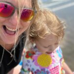 Ali Bastian Instagram - Travelling with allergies… I was asked recently how it was for us travelling as an allergy family. Here are a few of my top tips! As always, take what you need and forget the rest! 💖🌊⭐️… I was so nervous the first time. The airline were virtually impossible to get hold of before flying and deeply unhelpful when we did manage to speak to someone. HOWEVER… every time we have flown with them we have told them at the gate and they have made an announcement on the plane. The crew and ground staff are always very kind. The seats on this particular airline are plastic and I always do a high speed wipe down including the tray and seat belt with Detox wipes or soap based @marcelsgreensoapuk wipes if I’ve got organised enough to get some! … There are no seat pockets, so no old food hidden down there… bonus! I’ve found security with carrying medication and food generally pretty good. Bit of an issue over an ice pack on the way out this time, but in the end it was ok as I have to travel with ‘safe’ food for her… enough if we get delayed… and in this weather I need to keep it cool. Won the battle in the end but also, fully prepared to chuck them if it was a prob. Carrying all allergy travel plans & action plans is a must. Keep epis and antihistamine in boxes or bottles with pescription labels. We stay at my in-laws so there is a kitchen and we mainly cook there. We’ve found loads of free-from foods in Ireland. I definitely recommend looking at @theallergyteam for amazing resources on travel and life in general with allergies. Insulated @allerpacks for keeping epis at a stable temp in hot weather are brill! It’s always nerve wracking and I don’t want to get in a false sense of security as I know s**t can always happen! But so far, our experiences have been very positive and making memories feels so worth the anxiety and extra planning that goes in to it. At the end of the day, it’s about what feels right for you and your fam! 💖💖💖✈️🌈 #travel #allergy #allergyfriendly #allergyfamily #allergytravel