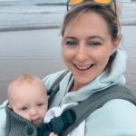 Ali Bastian Instagram - West Cork we 💚 you ☘️#travel #baby #babygirl #motherhood #family. Ps. It’s taken a few messages and comments for me to realise that Izzy is flicking the bird TWICE on this video. My child is a clown 🤣 Carrier @babybjorn #gift