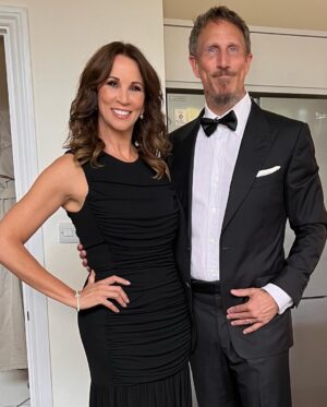 Andrea McLean Instagram - Tonight we are ‘out out’! Some ‘before we left the house’ pictures taken by @makeupcouk who is wholly responsible for making me look so glam. Thank you to @boodles for the jewellery tonight. 
Very impressed by Mr F in a dickie bow. 🥰
#wcw23

(And yes, that is an Elf fridge magnet behind us. Because Elf isn’t just for Christmas… 😁)