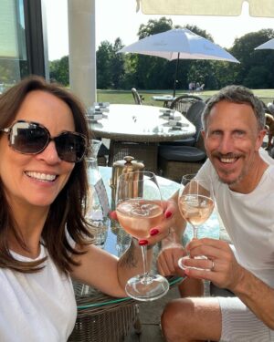 Andrea McLean Instagram - 4 things I did this week to fill my cup that had nothing to do with work:
1. My friend Andy popped in while passing through. He lives a long way away so we don’t see much of each other. It’s weird to think we first met at school 36 years ago - how in earth did THAT HAPPEN??!! It was nice to catch up. 
2. Mr F and I went for a long dog walk which culminated in an unplanned glass or two of rosé and dinner outside in the sunshine. I’m glad we did it as it feels like we caught the last bit of summer.
3. I chatted to my son Fin on the phone for two and a half hours. It’s been a bumpy few years while he’s been away at uni (any parents of kids who started during Covid know what I mean). We caught up on all sorts of things - films, telly, books, psychology, theology… I think we covered it all! This was a snap I sent him mid chat to show him my view of Teddy.
4. We went to Notting Hill Carnival today! Growing up in Trinidad means it’s always pretty special. We got there early, I had my curry and roti, we chipped along behind a few bands then we headed home before it got even busier. It was Amy’s first time - I was around her age when I last went to Carnival in Trinidad, which is a strange thought! This week seems to be a reminder about all the changes that have happened in my past and present… an unexpected reflection.
#4things