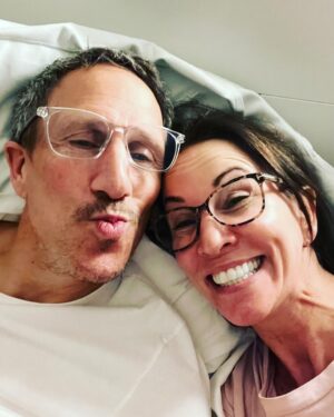 Andrea McLean Instagram - Sooo…
I have just seen that Mr F put out a beautiful reel, with lovely photos and a tune that has made me cry, to celebrate the fact that 10 years ago tonight we met on a blind date that would change our lives forever. 6 years ago tonight we got married. And tonight we celebrated by making fajitas with the kids and watching I’m A Celebrity. This is us now, 11pm, glasses on, reading in bed, me with my retainer in. I’m putting this picture out because for all lovely photos and dressing up, this is where our marriage and our relationship happens- at home, doing normal stuff, and dealing with all the ups, downs, ins and outs that come with being a blended family. And I am so happy with that. 
I love, and am loved in return. 
That’s the greatest gift I could ask for. 
Happy anniversary Mr F. 
I love you. ❤️