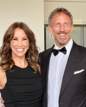Andrea McLean Instagram - Tonight we are ‘out out’! Some ‘before we left the house’ pictures taken by @makeupcouk who is wholly responsible for making me look so glam. Thank you to @boodles for the jewellery tonight. 
Very impressed by Mr F in a dickie bow. 🥰
#wcw23

(And yes, that is an Elf fridge magnet behind us. Because Elf isn’t just for Christmas… 😁)