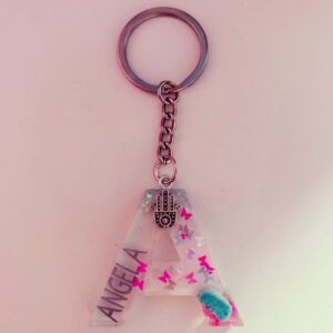 Angela Zahra Instagram - This is the cutest keyring ever, it was personalized specially for me by the talented @morgansmomentsgifts with all the things that i love, my name, pink butterflies, turquoise stone and the hamsa hand 🧿🦋 Go get your one @morgansmomentsgifts #morgansmomentsgifts #collaboration #collab #angelazahra 💕#انجيلا_زهراء #انجيلا_زهرة