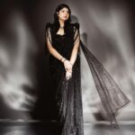 Anshula Kapoor Instagram - For a girl who has always been bigger than most, who’s insecure of her soft belly, and her back rolls, A sari has never been my go to Indian silhouette. And a sleeveles corset? Absolutely not! My first thought would be “I won’t find one In my size” or “it will squeeze the life out of me”. But 2024 is the year of being fearless 🙃. So when @shereenlovebug and @meghnadhall came over with this gorgeous black beaded corset sari with a cape, how could I let my insecurities for something that’s actually human and normal (and dare I say feminine) stop me from wearing the most gorgeous corset sari I’ve ever laid my eyes on? Most importantly, this is the most comfortable corset I’ve ever worn, and yes I didn’t think I would say those 2 words together ever, but that’s the magic of @meghnadhall When 2 fears come together, but it makes me feel fiercely beautiful instead of scared and conscious of my body, I call that a victory. One that can only be attributed to the best team ✨ Styled by @shereenlovebug with @⁨meghnadhall⁩ Style team - @snehhasuresh @salonitandel_ Makeup - @divyashetty_ Hair - @ruchithakur.5 Photographed by - @visualaffairs_va Sari - @meghnadhall Jewels - @amrapalijewels Bag - @bottegavenetaworld Footwear- @zara Thank you @shereenlovebug for making me jump out my comfort zone every single time. Even if it’s in black 🤓🖤
