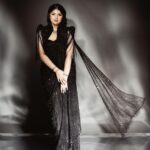 Anshula Kapoor Instagram - For a girl who has always been bigger than most, who’s insecure of her soft belly, and her back rolls, A sari has never been my go to Indian silhouette. And a sleeveles corset? Absolutely not! My first thought would be “I won’t find one In my size” or “it will squeeze the life out of me”. But 2024 is the year of being fearless 🙃. So when @shereenlovebug and @meghnadhall came over with this gorgeous black beaded corset sari with a cape, how could I let my insecurities for something that’s actually human and normal (and dare I say feminine) stop me from wearing the most gorgeous corset sari I’ve ever laid my eyes on? Most importantly, this is the most comfortable corset I’ve ever worn, and yes I didn’t think I would say those 2 words together ever, but that’s the magic of @meghnadhall When 2 fears come together, but it makes me feel fiercely beautiful instead of scared and conscious of my body, I call that a victory. One that can only be attributed to the best team ✨ Styled by @shereenlovebug with @⁨meghnadhall⁩ Style team - @snehhasuresh @salonitandel_ Makeup - @divyashetty_ Hair - @ruchithakur.5 Photographed by - @visualaffairs_va Sari - @meghnadhall Jewels - @amrapalijewels Bag - @bottegavenetaworld Footwear- @zara Thank you @shereenlovebug for making me jump out my comfort zone every single time. Even if it’s in black 🤓🖤