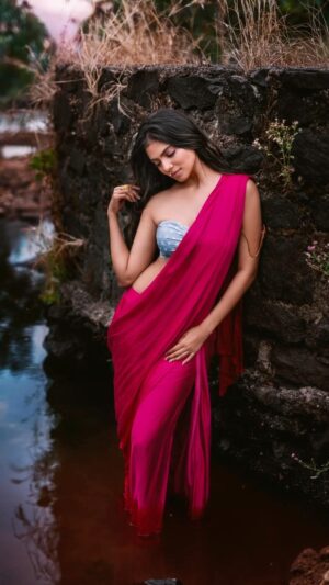 Arjun Kamath Instagram - As @malavikamohanan_ warmed up to the earthy surroundings of rugged rocks, tender green saplings, and the occasional company of melodious birds, her grace heightened with each passing moment. The camera was a mere observer that evening as she breathed in the crisp air, basked in the warmth of the sun, and spoke with the gentle winds.

On the other end, the storyteller in me was elated with how the little hamlet and its surroundings proved to be an apt canvas for Malavika’s flowy, vivid outfits. And, as the rosy sun tip-toed along the horizon, it was a delight for the artist in me to observe and capture Malavika’s wordless conversation with nature. 

These portraits thus chronicle the charming actress in her element, with my embellishments of vibrant colours, rich textures, and a lingering story in lap of nature.

#CapturedOnCanon with a Canon EOS 5D Mark IV @canonindia_official 

#reel #reels #reelsinstagram #reelsindia #indiareels #trendingreels #reelitfeelit #reelkarofeelkaro #portraits #actress #malavikamohanan #nature#pink #green #sunlight #sunshine #water #photography #fashionphotography #arjunkamathphotography  #DoGreatWithCanon #EOSMaestro #instagood #instagram
