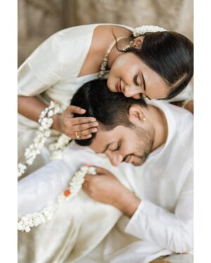 Arjun Kamath Instagram - In the tender blush of dawn, 
Love unfurls its sacred spawn. 
Sudha's saree, off-white dreams, 
Flowing by the temple streams.

Ranjith, in kurta, pure and bright, 
Together they're a classic sight. 
Beneath the boughs of Bengaluru's charm, 
Their clasped hands bring silent calm.

Laughter echoes 'midst the stones, 
Ancient whispers, future tones. 
This morn of gold, this joy, this peak, 
Where hearts converse, no need to speak.

Ethereal light, a love so bold, 
Their story in the sunlight told. 
In every frame, their spirits dance, 
Pre-wedding joys, sweet, silent romance.

Sudha + Ranjith, Bengaluru 2023

Make-up & hair - @makeoversbypriyankark @makeupbysharanya 

#CapturedOnCanon with a @canonindia_official EOS R5 

#arjunkamathphotography #photography  #weddingphotography #preweddingshoot #preweddingphotography #prewedding #bengaluru #temple #sunrise #saree #vibewithcanon #DoGreatWithCanon #canwithcanon #MentorsInFocus #EOSMaestro #instagood #instamood #instagram