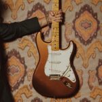 Bruno Mars Instagram – The @BrunoMars Stratocaster is a true treasure. Crafted from resonant ash, this limited edition guitar features sculpted American Ultra body contours for unmatched comfort and seamless access to high notes. The Mars Mocha Heirloom nitrocellulose lacquer finish not only gives it an aged charm, but also enhances resonance and tone. Head to the link in bio to learn more.