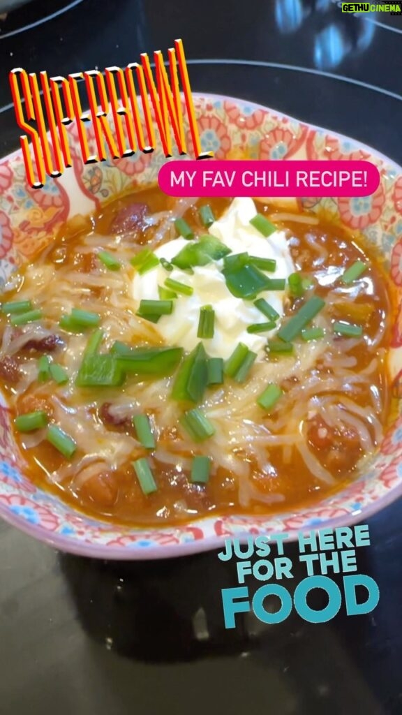 Catherine Bell Instagram - Easy quick Super Bowl (or any time) chili! 😋 add sour cream, shredded cheese, chives, jalapeños, and crumble Fritos!! Yum! 1 lb. ground beef we used 15% fat 1/2 medium yellow onion finely diced 1 tablespoon minced garlic 1 15-oz. can pinto beans drained and rinsed 1 15-oz. can kidney beans drained and rinsed 1 15-oz. can tomato sauce 1 15-oz. can diced tomatoes 3 tablespoons tomato paste 1 tablespoon maple syrup 3 tablespoons chili powder 2 teaspoons garlic powder 2 teaspoons ground cumin 1/2 teaspoon smoked paprika 1/2 teaspoons salt 1/4 teaspoon ground pepper 1 cup beef or chicken broth Optional toppings shredded cheddar cheese Fritos - the best!! green onion First, heat a large stockpot over medium/high heat. Then, add ground beef, yellow onion, and minced garlic and sauté for 7-10 minutes or until beef is fully browned. Next, add pinto beans, kidney beans, tomato sauce, diced tomatoes, tomato paste, and maple syrup to the pot and stir to combine. Add spices and 1 cup of broth and stir to combine. Bring beef chili to a boil, then reduce heat to low and let simmer for 10-15 minutes to thicken. ENJOY! 😉 #nfl #superbowl #chili