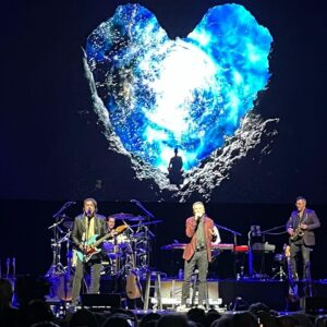 Craig Shoemaker Instagram - Last night, a guest of @thekennyloggins - his final shows of a stellar 55 career. 

So surreal.  Was often moved, thinking back to when I was a kid in comedy, and this music master took me on tour w/him, back when communication was pen/paper/pay phones, and high tech was a smoke machine! 

I suddenly went from playing smoky clubs (yes kids, REAL stink-smoke, not vape), traveling w/a crew & band, a huge departure from the solo destination dash of a standup comic. 

A tour manager, and a group of guys to play with, try out material.  When we hit the Neil Simon Theatre, a band member became ill, Kenny asked me to learn the bass notes over dinner, and I sang backup for a week on Broadway!  Crazy…

Amazing concert last night, w/all the hits.  Such a prolific writer, gifted vocalist. 

I believe he belongs in the songwriters Hall of Fame. Countless hit songs. Google it.  There are 80s soundtrack hits like, “I’m Alright,” and “Footloose,” but much more.  Celebrate Me Home was ethereal astounding last night. 

I’d like to plant seeds here.  If you think @thekennyloggins should be in the Songwriters Hall of Fame - gimme a YES in the comments.  Tell all to vote here.  I’ll get it to the chiefs in charge.  Celebrate him home - to the HOF. 

Kenny is reading this.  Thank him with a vote, for a career to remember. 

#thisisit #showbiz #lovemylife #luckyman #grateful #kennyloggins #halloffame #songwriters