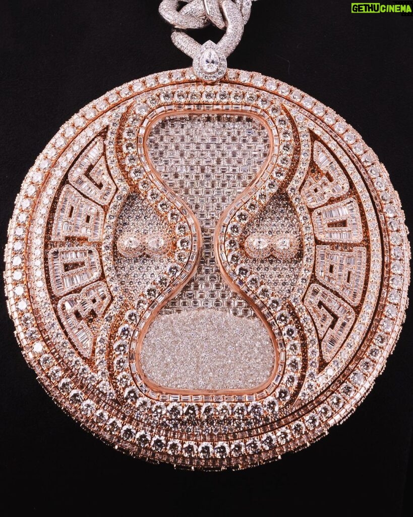 Davido Instagram - Davido’s bespoke pendant, dedicated to the success of his new album ‘Timeless’. A timeless ‘hourglass’ design, crafted with meticulous detail and hand selected diamonds. A moving hourglass, enclosed with diamond dust. A 350ct diamond pendant, weighing 1.5kg. Crafted with meticulous attention to detail. This exquisite pendant features hand-picked diamonds, constructed with a 1 carat pear diamond above the pendant. 4 - 0.5ct pear diamonds in the centre. A 30 pointer boarder for ‘30 Billion Gang’, as well as a 30 pointer boarder around the hourlgass. ‘30BG’ across the bespoke cuban chain. ‘30BG’ Baguette cut display. Designed in-house by our Local Kettle Brothers jewellery specialist team Cole, Emmanuel and Ethan. The "Timeless" pendant is a breathtaking masterpiece designed exclusively for Davido. A true embodiment of Davido’s unique style, the "Timeless" pendant is a symbol of inspiration, creativity, and enduring beauty that will adorn the wearer for generations to come.