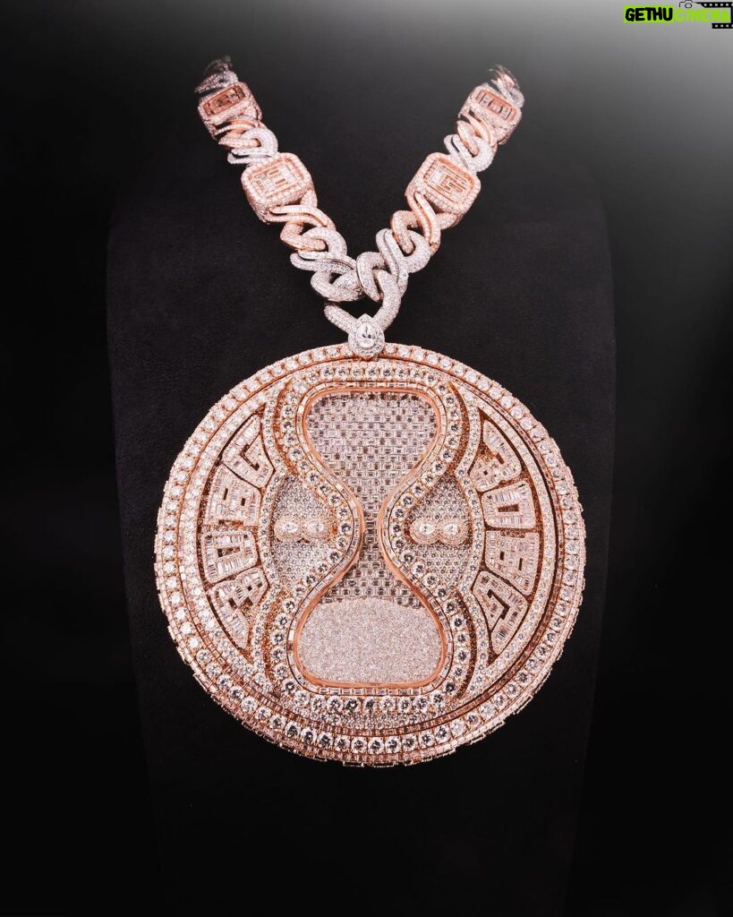 Davido Instagram - Davido’s bespoke pendant, dedicated to the success of his new album ‘Timeless’. A timeless ‘hourglass’ design, crafted with meticulous detail and hand selected diamonds. A moving hourglass, enclosed with diamond dust. A 350ct diamond pendant, weighing 1.5kg. Crafted with meticulous attention to detail. This exquisite pendant features hand-picked diamonds, constructed with a 1 carat pear diamond above the pendant. 4 - 0.5ct pear diamonds in the centre. A 30 pointer boarder for ‘30 Billion Gang’, as well as a 30 pointer boarder around the hourlgass. ‘30BG’ across the bespoke cuban chain. ‘30BG’ Baguette cut display. Designed in-house by our Local Kettle Brothers jewellery specialist team Cole, Emmanuel and Ethan. The "Timeless" pendant is a breathtaking masterpiece designed exclusively for Davido. A true embodiment of Davido’s unique style, the "Timeless" pendant is a symbol of inspiration, creativity, and enduring beauty that will adorn the wearer for generations to come.