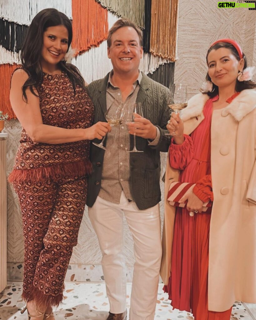 Dawn McCoy Instagram - Cheers to our dear - and talented - friend, @christopherkennedyinc on his newest design project launch, @canopywinelounge, in downtown Palm Springs. A beautifully designed space that both celebrates the desert you’re in and also makes you feel like you’re being transported to an exotic destination - Canopy is sure to be the newest hot spot for Palm Springs locals and tourists alike. From the decadent, velvet chartreuse booths to the tall, white paper trees and vegetation, you cozy up in there, thinking to yourself, “I’ve never been anywhere quite like THIS before.” And how spectacular is that? I’m also so proud to toot another friend’s horn who is involved in this opening - my wonderful friend, @lowiemoore @lawrencemooreassociates is Canopy’s PR. So you know who you need to contact if you’d like to cover it for press. I loved it so much that I’m not even slightly exaggerating when I say that I can’t wait to get back. Sure to be new favorite place to meet friends and business associates (and work solo while enjoying a glass of wine), my favorite wine I tried was their Justice Cabernet. How perfect is that? It’s a sign if you ask me.🍷 @kellygolightly and I - as well as a slew of other friends (as you can see) had the loveliest time and I can’t think of a better way to welcome in the holidays than hugging friends while celebrating other friends’ successes. ☺️🎄❤️ Kelly and I even sported her @kellygolightly x @bethladdcollections swan earrings and clutches and our @jouercosmetics x @lovingwayfoundation lip kits.💋 My ensemble: @trinaturk - styled by @denise_in_socal My shoes: @seychellesshoes at @trinaturk @shopelpaseo Palm Springs, California