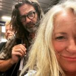 Deana Carter Instagram - My sweet lil’G in her “missing us yoga pose” & another travel day. Look at these characters behind me! 👀 Pardon my “rat’s nest” o’hair!! Looking forward to #wildwoodnj show tomorrow! 🙌🏻💖 Philadelphia International Airport