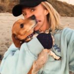 Debbie Gibson Instagram - And then there were 2 … ❤️🐶 ❤️🐶 I had this beach scenario planned for our pack of 3 🐶 🌈coming up and I’m not gonna woulda coulda shoulda cuz the Universe has plans so far beyond what we can comprehend and those hindsight 20/20 glasses are apparently sold out. But we have been bonding and processing as a pack. As a family. I’m so happy to have this moment to breathe and to feel everything because each loss we go through brings back previous loss in my experience. I’m very serene, just introspective and taking stock of what and who is important in my life. I’m very intentional with my love and energy which always feels authentic. Extra vulnerable but, I wouldn’t have it any other way. If you love hard , you’re gonna feel loss hard. And funny enough , in the wake of so much loss in the past couple of years I can only foresee loving even harder. Tomorrow is 35 Years of Lost in Your Eyes. I don’t have any fancy post prepared as things have been kinda wild and I do my social media stuff myself. Just plan to talk to you all visually or through words. The music and how you’ve all embraced it says it ALL !!! I look forward to sharing your stories and posts and please invite me to collab. Maybe one will strike my fancy ! G’night everyone 🤍 #beach #dog #dogmom #dachshundsofinstagram PS Thank you @lecafedelaplagemalibu for my amazing hoodie ! 🩵 Malibu Beach
