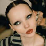 Dove Cameron Instagram - un petit garçon arrive à paris !! 👩🏻‍❤️‍💋‍👩🏻 merci @kenzo for a magical evening, @nigo impeccably fresh blend of masculin et féminin on the seine au coucher du soleil. vous êtes une source d'inspiration🌸🌸🌸 photo: @dariasenin 🩰