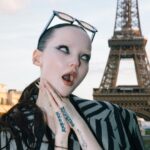 Dove Cameron Instagram - un petit garçon arrive à paris !! 👩🏻‍❤️‍💋‍👩🏻 merci @kenzo for a magical evening, @nigo impeccably fresh blend of masculin et féminin on the seine au coucher du soleil. vous êtes une source d'inspiration🌸🌸🌸 photo: @dariasenin 🩰