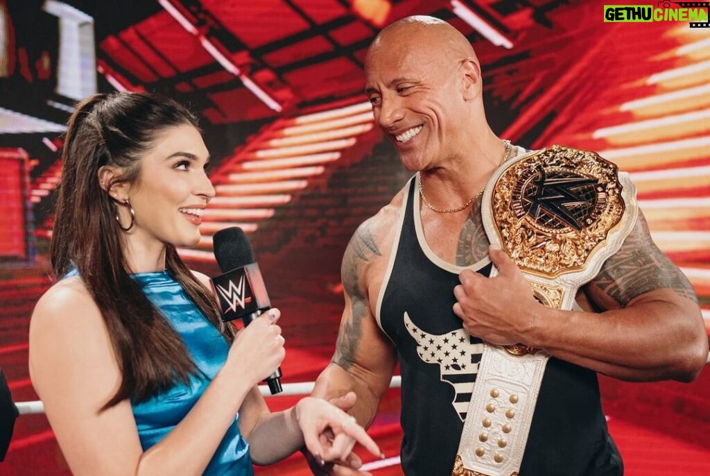 Dwayne Johnson Instagram - She wears black. I love black. She’s a bad ass. And I got famous for wearing a fanny pack. We had fun f*cking around backstage 😈🥃 Love, appreciate and respect you champ @rhearipley_wwe - thanks for trusting me with your title, keep kickin’ ass and raising the bar 🖤💪🏾 Big shout to @cathykelley for being a total pro and having fun 🎤 👊🏾 #peopleschamp ✊🏾 📸 @flanneryunderwood @wwe