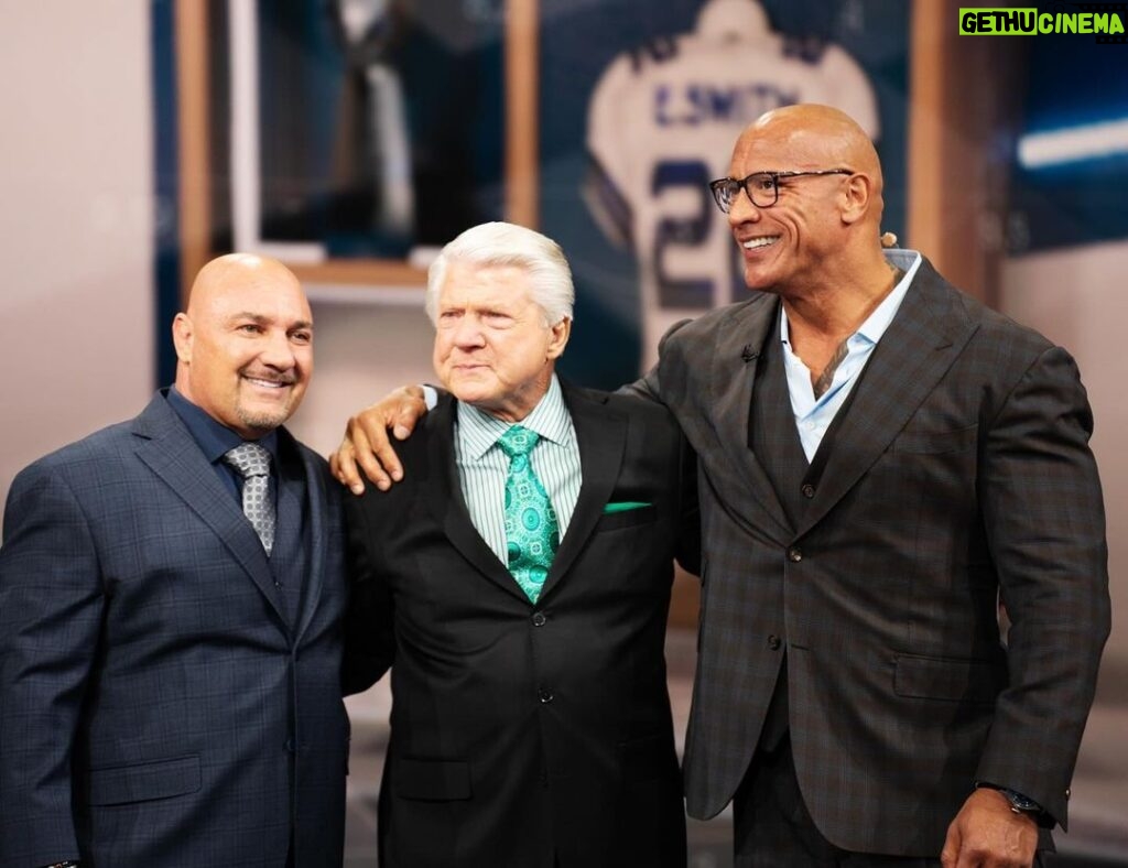 Dwayne Johnson Instagram - Very cool (and emotional) moment to share with the legendary GOAT @jimmyjohnson4616 - giving Jimmy his flowers for his induction into the @dallascowboys RING OF HONOR. This @nflonfox team is the best in the business and what a moment I was very grateful and privileged to share with them. @michaelstrahan @jayglazer Howie Long Terry Bradshaw Curt Menefee @foxsports @canesfootball #UFL