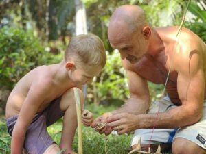 Ed Stafford Instagram - It’s good to be home 🥰. Don’t get me wrong I love my job - but nothing in the world compares to this. Ran has watched every episode of the original Marooned series since I’ve been in Africa and is now addicted to making cordage and setting traps 🪤. Don’t worry Costa Rica - no animals we harmed in the making of this post! 🤣 #traps #snares #survival #daddytime
