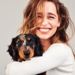 Emilia Clarke Instagram - Ted (loook into his eyes) and I, wanted to let you know that 2021 is going to be what it will be, less making resolutions and more breathing our way through every damn beautiful day we get given on planet Earth. Oh and this photo is what happens when you’re shooting a @clinique campaign and someone feels left out. Turns out he’s a born poser, just like his mamma,😍🥸🐶🕺 #tedknowsaboutlife #stepandbreathe #happynewtomorrowbeauties #💪🏻