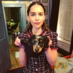 Emilia Clarke Instagram - My puppy fits INTO A HAT. Job done. He didn’t accompany me to the @chanelofficial Charles Finch dinner but....he would’ve fit right in. To my hat. (And my champagne glass) #❤️ #👏 #tedtakesonthetown @kateleemakeup @earlsimms2 @chloebeeneystyling @petraflannery thank you for coming round to watch Ted eat all your equipment and, as a side note, painting me a dream @chanelofficial picture... ❤️