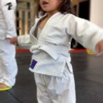 Frank Camacho Instagram – Stepping onto the mat with the biggest little smile, my 2-year-old girl began her first #Purebred Tiny Smashers Jiujitsu class today and my heart is doing somersaults! 🌟🥋✨ It’s more than just cute gi’s and playful tumbles; it’s about shaping her young mind with respect, teamwork, physical health, and discipline. 💪🧠 This is where she’ll learn to fall and rise, and embrace the joy of the journey. If you’re ready for your little ones to start a path filled with fun, fitness, and lifelong lessons, send us a message! 📩👶🤼‍♂️ #ProudDad #FirstGi #JiujitsuKids #sharejiujitsu #purebredjiujitsu Purebred BJJ Guam