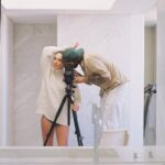 Gal Gadot Instagram - the Dude and I 🤍 by @dudihasson1 We worked together on one of my very first modeling jobs and 20 years later he is still my photographer and close friend. Dudi has the ability and talent to capture me in the most unique moments and this is a little BTS photo of one of those rare moments