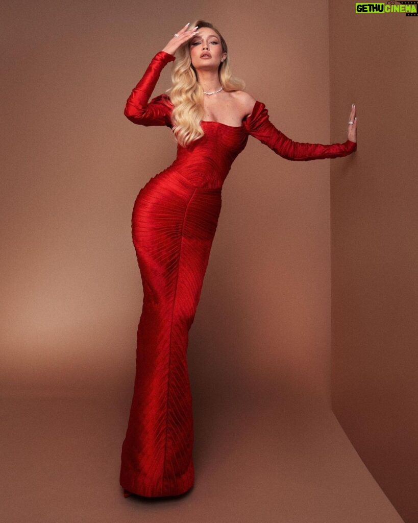Gigi Hadid Instagram - Proud to wear custom by independent @zacposen for @vanityfair’s Oscar party, by @gregswalesart @patrickta @laurapolko @mimicuttrell ❤️‍🔥🍸