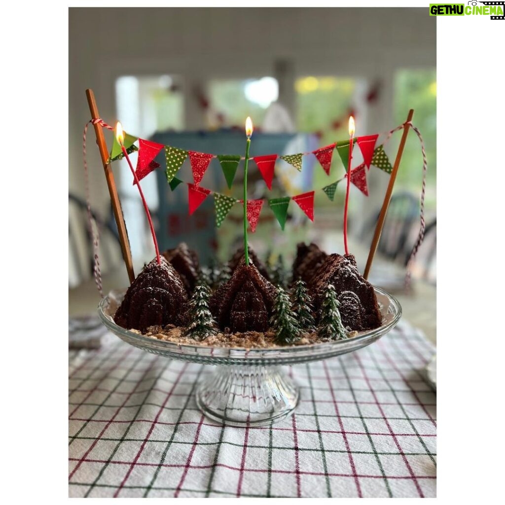 Ginnifer Goodwin Instagram - HBD, my honey! The boys and I baked Birthday Village for King @joshdallas’ cake breakfast. We used a chocolate pound cake recipe by @trishayearwood with our @nordicwareusa Cozy Village Pan. The dirt paths are compliments of crumbled @mcvitiesofficial. We hung bunting (from my chopsticks) and planted trees that we found on @etsy. Then it powdered-sugar-snowed! Please throw your bday traditions at me! >>