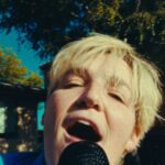 Grace Baldridge Instagram - rumor rumor have you heard? heartbreak hero is out day after tomorrow ❤️‍🩹 #nationalcomingoutday #queerartist #newmusic 🎥 @jaxanderson