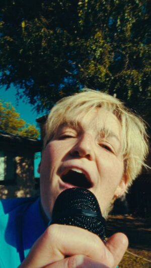 Grace Baldridge Instagram - rumor rumor have you heard? heartbreak hero is out day after tomorrow ❤️‍🩹 #nationalcomingoutday #queerartist #newmusic 

🎥 @jaxanderson