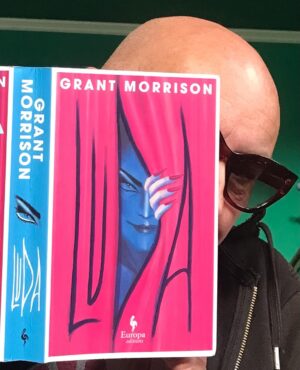 Grant Morrison Instagram - LUDA - out now for the in crowd…!

Life in a lucky bag. 

Link in bio to pick up a copy.

#Luda #novel #newrelease #pantomime #friday13th