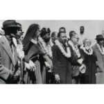 Hāwane Rios Instagram – In honor of Martin Luther King Jr Day, These are the leis made by mothers at Kawaiahaʻo Church that were sent to Dr. Martin Luther King Jr for his march to Montgomery from Selma in 1965. Dr. Martin Luther King Jr. preached at Kawaiahaʻo Church a month prior to Selma and said that Hawaiʻi was “…[an] inspiration and a noble example of racial harmony”. 

Rev Akaka and the women of Kawaiahaʻo Church made these leis for Dr. King to show their support for the Civil Rights Movement and the lei was “representing a symbol of hope and peace in the face of fear and ignorance” from the people of Hawaiʻi. 

Martin Luther King Jr. was touched by Hawai’i year when he first visited the islands years earlier in 1959. 

In an address to the state legislature, when it still met at ʻIolani Palace:

“…As I think of the struggle that we are engaged in in the South land, we look to you for inspiration and as a noble example, where you have already accomplished in the area of racial harmony and racial justice what we are struggling to accomplish in other sections of the country, and you can never know what it means to those of us caught for the moment in the tragic and often dark midnight of man’s inhumanity to man, to come to a place where we see the glowing daybreak of freedom and dignity and racial justice….”

Upon his return, he stated to his congregation:
“As I looked at all of these various faces and various colors mingled together like the waters of the sea, I could see only one face— the face of the future!” (Dexter Echo, 4 November 1959)

The first pic is that of  Rev. Abraham Akaka and his daughter with the leis. With the leis, Rev. Akaka included the following note to Dr. King: 

Dear Brother Martin Luther King – 

As you “bring good news to the meek, bind up those that are bruised, release to captives” our Prayer and Aloha reach out to enfold you.

These flower lei were made by mothers of the Kawaiaha‘o Church — for you and our brothers in the cause of our Lord Jesus whose commandment
you obey:

“Feed my lambs”

Tend my sheep

Feed my sheep”

History will honor this hour because His chosen servant was faithful and a great nation responded to that faithfulness. 

A.A.