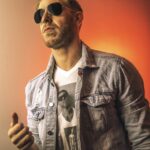 James Cipperly Instagram - Keep it. . . . #baybee #monday #orange #potrait #thumb #shades #denim #face #head #shoulders . Photo: @beyondgorilla